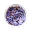 a bowl of purple flowers